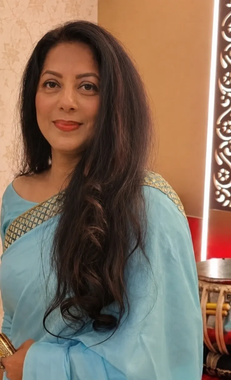 Maria Ahmed in a sky-blue saree at a celebration